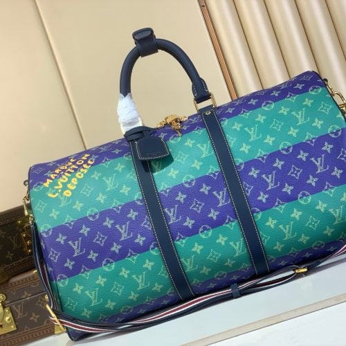 Louis Vuitton Keepall-style multicolor duffle bag – green and blue monogram print with black leather handles, front view